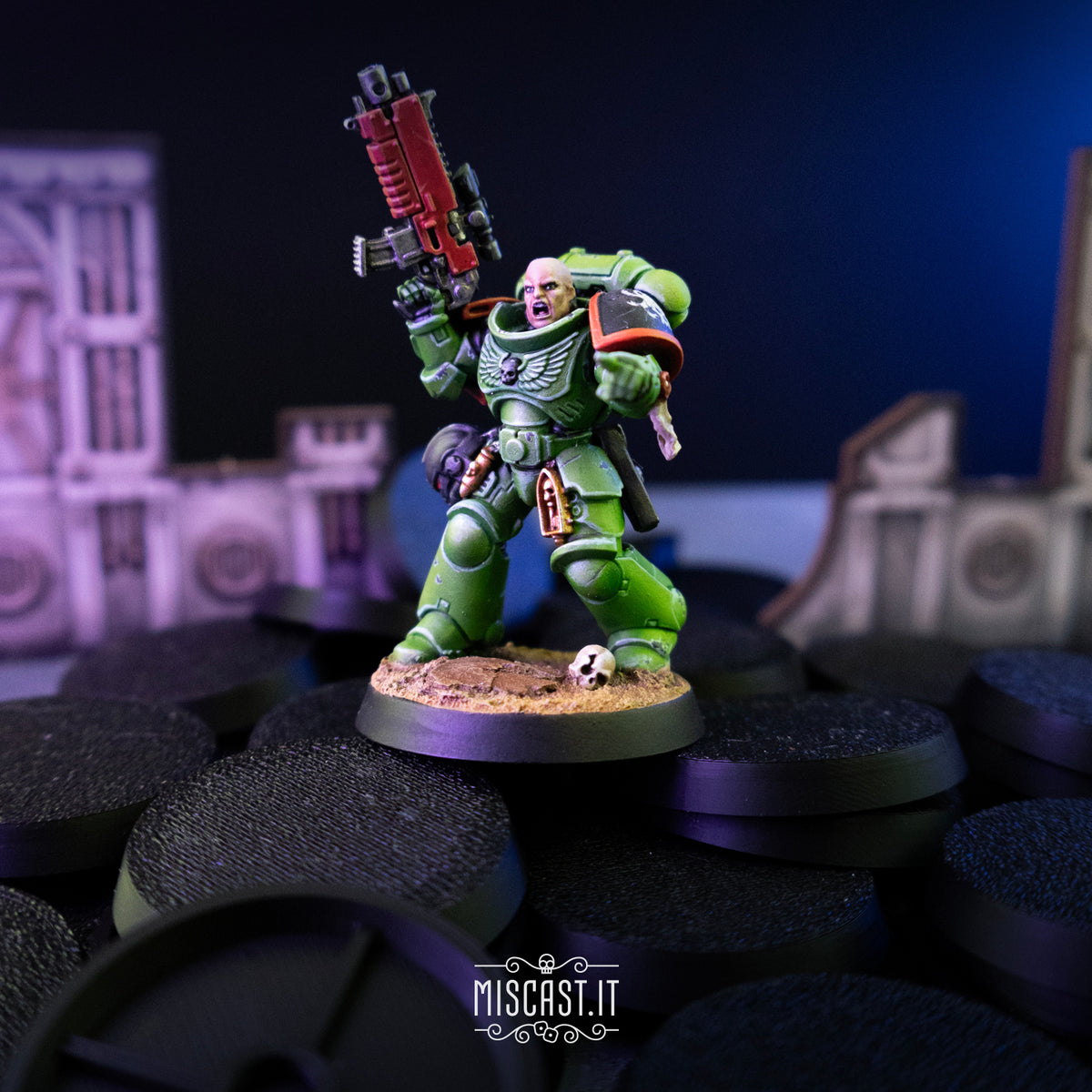 Painted Warhammer 40,000 miniature standing on a pile of Miscast 40K Round Bases